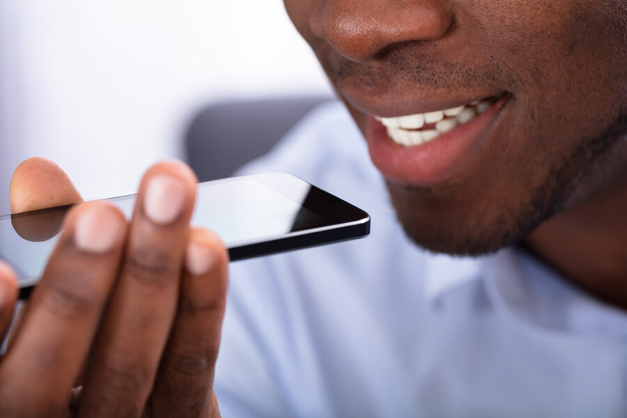 Close-up Of a Man Using Voice Assistant On Cellphone.