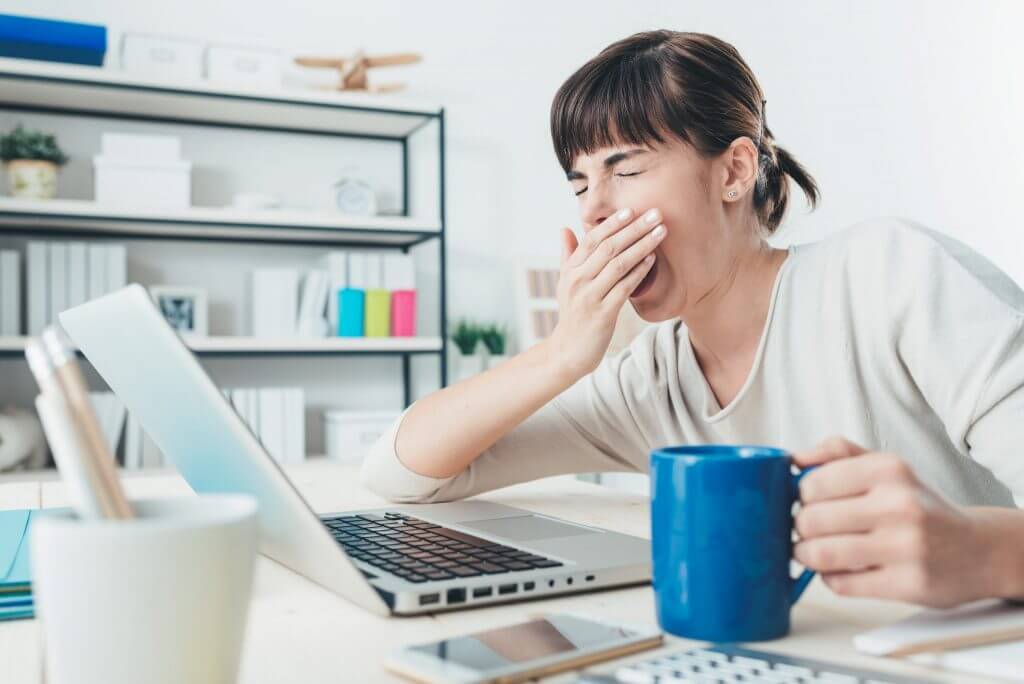 tired woman working late at agency