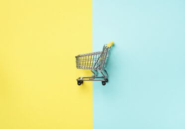Concept image of an empty toy shopping trolley